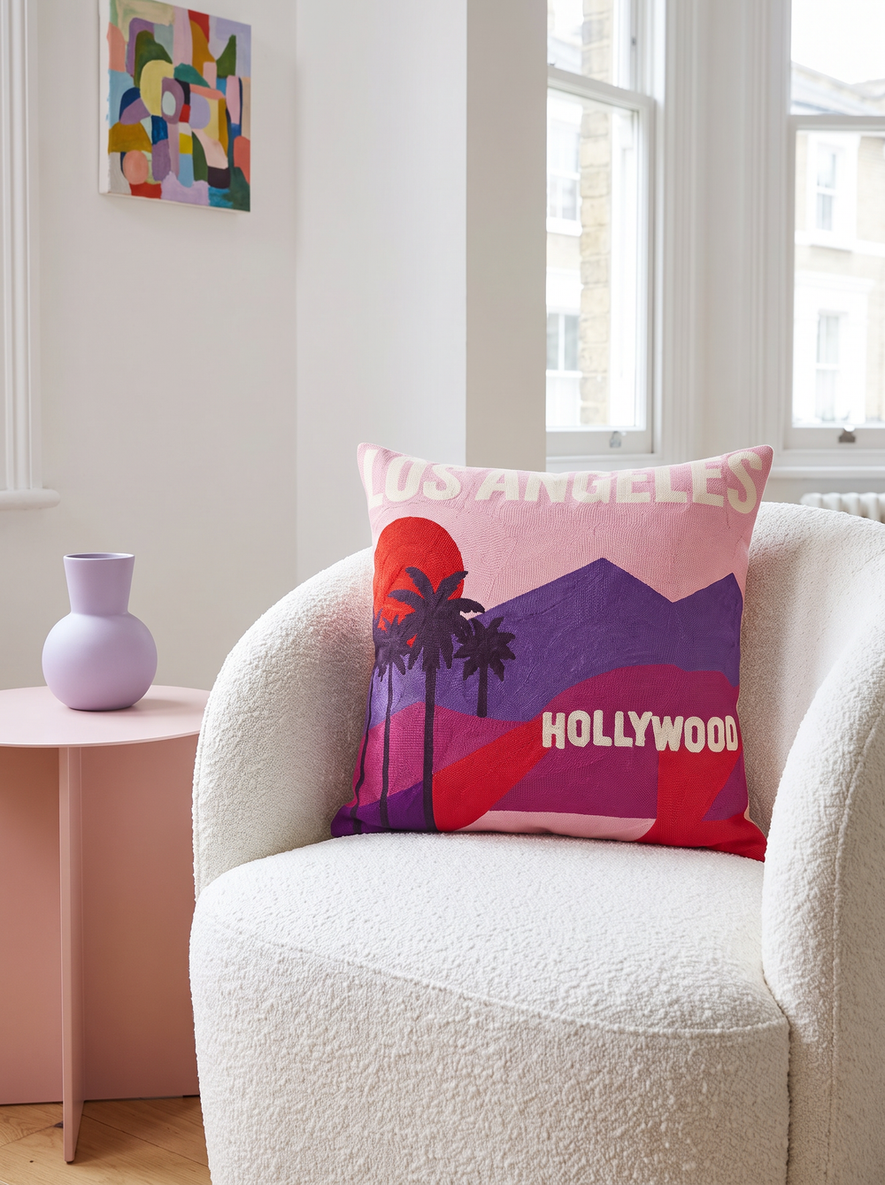 Los Angeles needlepoint cushion styled at home