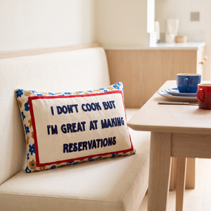 I Don't Cook But I'm Great At Making Reservations needlepoint cushion styled at home