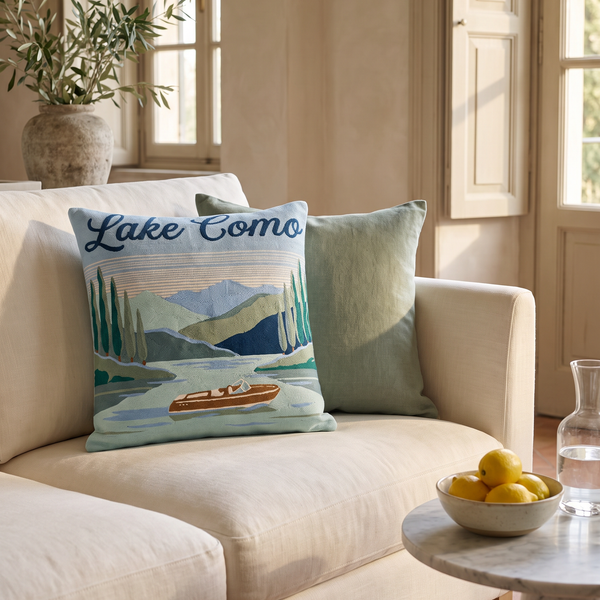 Lake Como needlepoint cushion styled in a bright living room